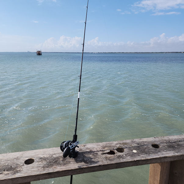 Fishing pier over calm coastal water
